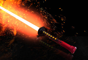 A lit lightsaber surrounded by flames and sparks